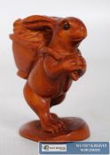 A wooden carving of a hare