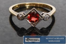 A 1920`s / 1930`s Art Deco 18ct platinum ring with centre set ruby in lozenge having circular set