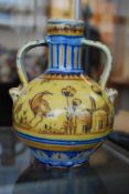 A 19th century Delft twin handled ovoid bottle vase having decorative birds and farm scenery. 17cms