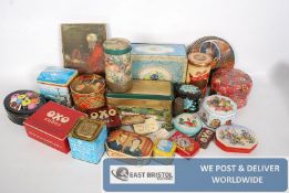 A good collection of vintage tins to include Oxo, Butlins, biscuit tins and other items