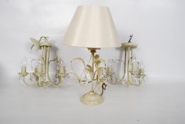 Shabby chic chandeliers with glass droplets along with a matching table lamp.