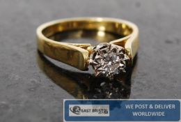 An 18ct gold and diamond illusion centre set diamond ring. The diamond being set within bezel being