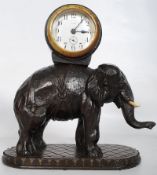A carved elephant carrying timepiece clock