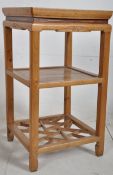 An early 20th century Chinese plant stand constructed of hardwood and yellow pine. The squared