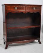 A Georgian style mahogany inlaid bow front bookcase. French kick legs with open bookcase window