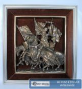 A framed relief plaque of medieval knights on horseback together with one other by DH Morton and a