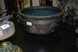 An early 20th century large Chinese brass censer / cauldron. Tapered feet with chased mountain /