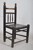 An 18th century peg jointed North country ladderback chair. Turned legs united by stretchers under