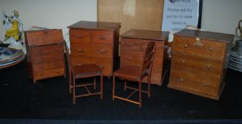 A good collection of vintage oversized dolls house furniture to include chests of drawers, chairs,