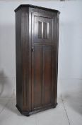 A 1930`s Jacobean Revival sentry box oak hall cupboard / wardrobe. Full length fielded panel door