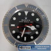 An advertising shop display wall clock, stamped `Rolex.`