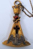 A Spencer of London Masonic medallion pendant on chain. Gold plated with chased decoration, enamel