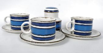 A quantity of Midwinter Moon pattern pottery consisting of 3 cups, 3 saucers, and a sugar bowl.