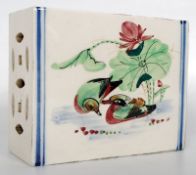 A Chinese famille rose porcelain pillow / headrest dating to the 19th century. Rectangular form,