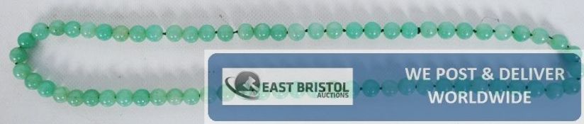 A fine string of jade style beads.