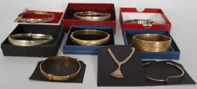 A collection of white metal silver bracelets, and rolled gold bracelets marked 925.