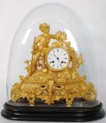 A french 8 day gilt metal and spelter clock by Mourey complete in glass dome with ebonised base.