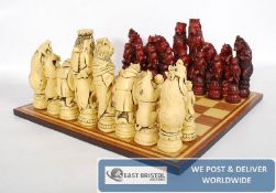 A good quality large character resin chess set complete with board.