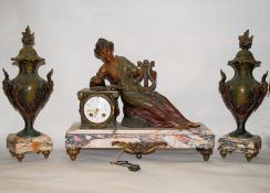 A 1930's Art Deco French spelter and marble gilt metal and mounted clock garniture. The clock with