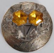 A scottish silver thistle brooch with inset amber stones 21.8g.