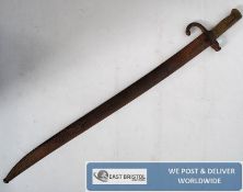 A French 19th century 1869 Model Chassepot rifle bayonet with shaped and ribbed brass grip and