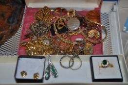 A quantity of assorted costume jewellery to include rings, earrings, brooches necklaces and other
