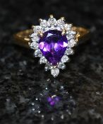 A 14ct gold claw set amethyst & diamond heart shaped solitaire ring.