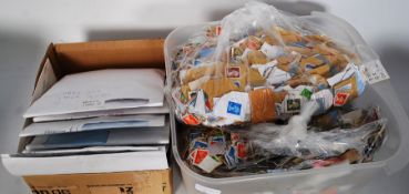 A large quantity of stamps, some on paper, and others loose.