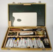 An artists box of oil paints.