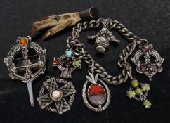 A selection of celtic costume jewellery to include bracelet, 2 brooches and a pheasants claw brooch