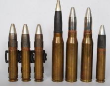 A selection of 30mm cartridges and shells, some from AFV and 3 in a steel clip / belt.