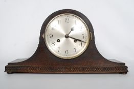 A Napolean Hat mantel clock with 8 day movement, complete with a key.
