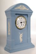 A Wedgwood blue jasperware mantle clock having inset quartz movement. 22cms tall
