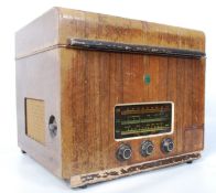 A 1930's Garrard radiogram / record player in wooden carry case.  Hinged top opening to reveal a
