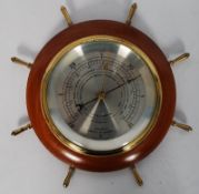 A Comitti of London ships wheel barometer in mahogany surround together with another Comitti banjo