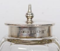 2 hallmarked silver topped glass pots with hallmarks to the lids.