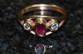 A 9ct gold, diamond and ruby ring pierced set half eternity ring. The stones approximately 50pts.