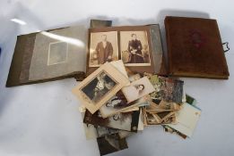 A good quantity of Victorian photographic Carte De Visites, along with 20th century photo album