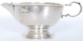 A Birmingham 1932 solid silver hallmarked creamer. Makers marks for M & J. 8cms High x 8cms