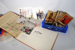 A mixed lot of ephemera to include vintage postcards, magazines, Naval & Military items etc.