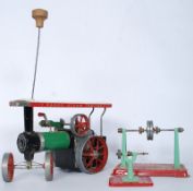 A vintage Mamod steam tractor with 2 smaller Mamod fly wheels.