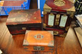 Three decorative Chinese jewellery boxes, one with jade style panels to front and sides.