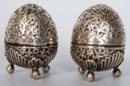 2 decorative Indian silver plated metal salt & pepper condiments, both chased in decoration standing