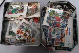 Two tins of stamps, encorporating Great Britain and world examples.
