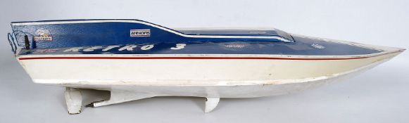 A fuel powered 'Retro 3' power racing model radio controlled boat, with part radio gear. In blue and