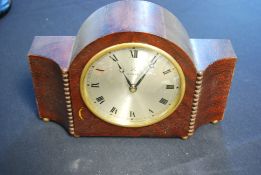 An early 20th century 8 day mantle clock by the Hamburg Amerika Co. Crossed arrows to the face