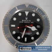 An advertising shop display wall clock, stamped 'Rolex.'