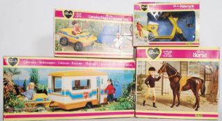 A vintage pedigree Sindy Caravan, camping, buggy, horse and scooter. All in original boxes. Most are
