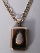 A silver hallmarked locket with inset fire opal mounted to an Italian 925 silver metal necklace