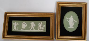 Two wedgewood cameo plaques, both framed.